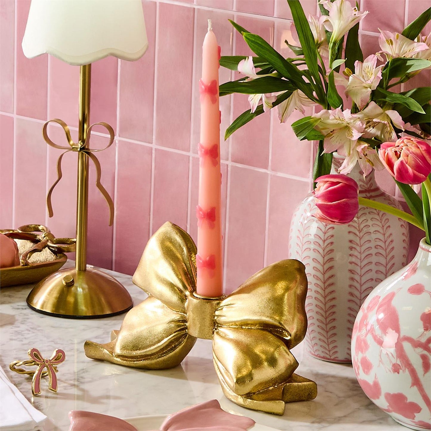 TWO'S COMPANY LARGE GOLD BOW TAPER CANDLEHOLDER