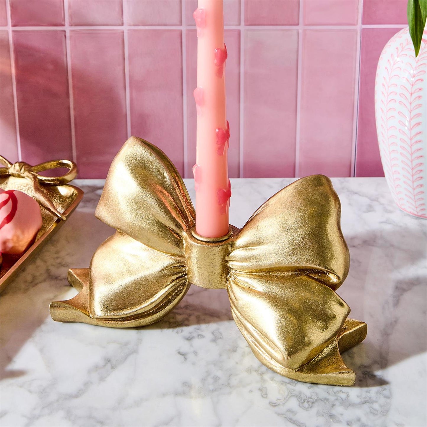 TWO'S COMPANY LARGE GOLD BOW TAPER CANDLEHOLDER